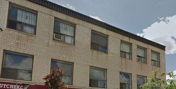 Toronto apartment for rent - A brick building with a sign that says Butcher's.