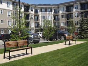 Airdrie apartment for rent - Airdrie Place in Airdrie, AB Building exterior highlighting modern design and parking lot