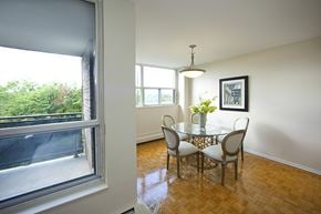 Toronto apartment for rent - Brookbanks Apartments cozy dining area with balcony access in Toronto, ON