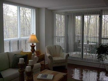 Toronto apartment for rent - a living room with a couch and a chair
