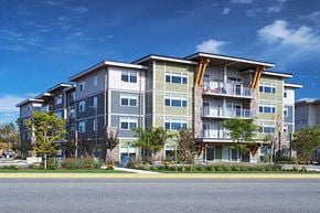 Nanaimo apartment for rent - A large apartment building with a balcony on the second floor.