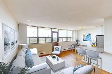 London apartment for rent - A living room with a grey couch and a coffee table.