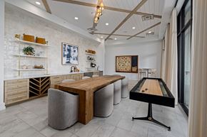 Wake Forest apartment for rent - A room with a pool table and a shelf with various items on it.