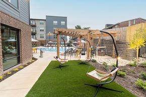 Nashville apartment for rent - the yard with swings and a pool at the trilogy apartments