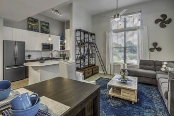 Charlotte apartment for rent - a living room with a couch and a table and a kitchen