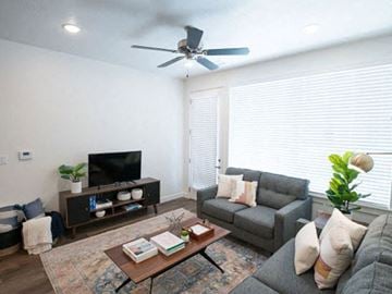Logan townhouse for rent - a living room with a couch and a coffee table