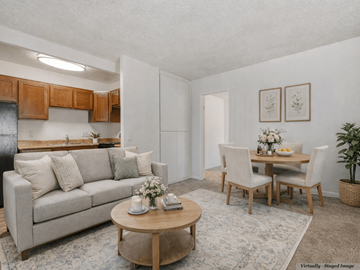 Spring Valley apartment for rent - A living room with a couch, chairs, and a dining table set up.