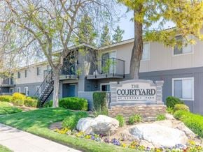 Fresno apartment for rent - Welcoming Property Signage at Courtyard at Central Park Apartments, Fresno, California
