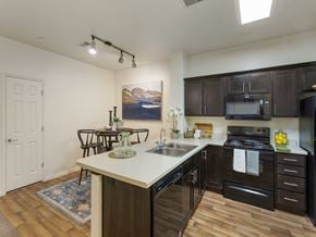 Midvale townhouse for rent - Kitchen with Black Appliances at Talavera at the Junction