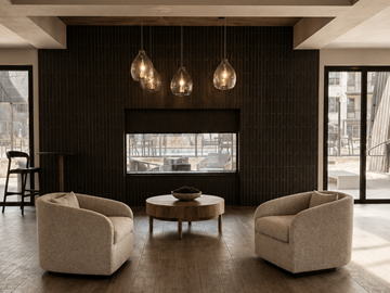 Herriman apartment for rent - A living room with a fireplace, two chairs and a coffee table.