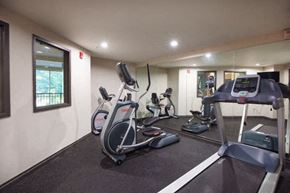 Renton apartment for rent - Fitness Center Equipment at Metropolitan Place Apartments, Washington, 98057