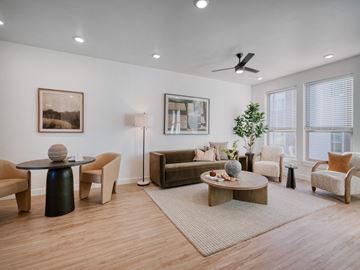 Billings townhouse for rent - A living room with a black coffee table and a brown chair.