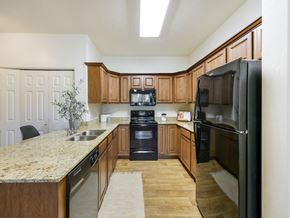 Logan townhouse for rent - Kitchen with Black Appliances at Falls at Riverwoods