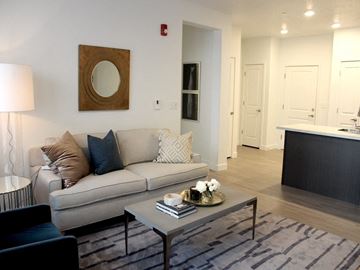 Sandy apartment for rent - a living room with a couch and a coffee table