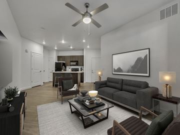 Salt Lake City apartment for rent - A modern living room with a grey sofa and a coffee table.