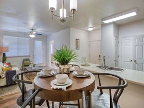 Midvale townhouse for rent - A dining room with a wooden table set for two.