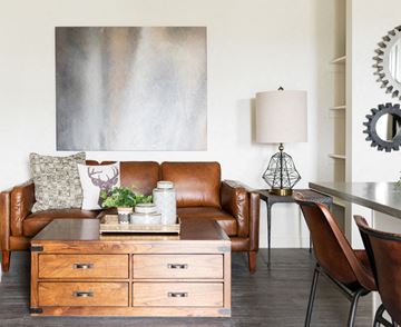 American Fork apartment for rent - a living room with a leather couch and a wooden table