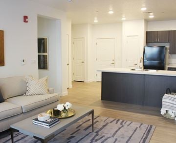 Sandy apartment for rent - a living room with a couch and a table