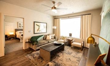 Herriman apartment for rent - a living room with a couch and a ceiling fan