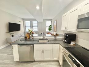 Philadelphia apartment for rent - a kitchen with white cabinets and a counter top