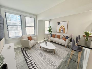 Philadelphia apartment for rent - an open living room with couches and a table