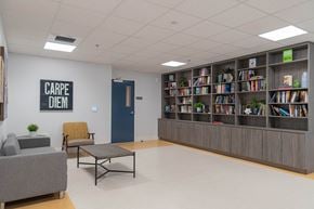 Inglewood apartment for rent - A library with a sign that says "Carpe Diem" on the wall.