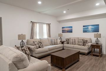 Huntington Park apartment for rent - A living room with a white couch and a wooden coffee table.
