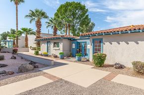 Phoenix apartment for rent - A house with a blue door and a red tile roof.