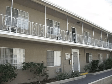 North Hollywood apartment for rent - A building with a white door and windows with white frames.