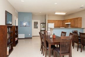 Douglas apartment for rent - a dining area with a table and chairs and a kitchen in the background