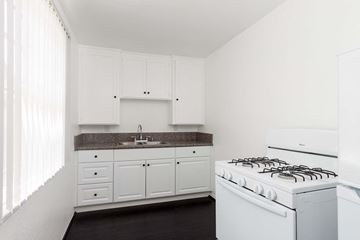 Long Beach apartment for rent - a white kitchen with white appliances and white cabinets