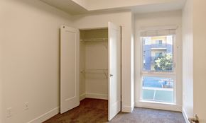 Gilroy apartment for rent - an empty bedroom with a closet and a window