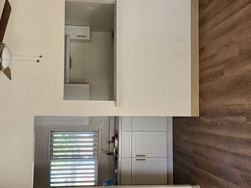 Coachella apartment for rent - a view of a kitchen with a mirror and a door