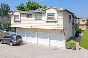 Sherman Oaks apartment for rent - A two-story house with a garage and a car parked in front.