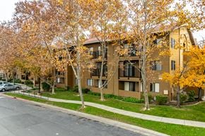 Sacramento apartment for rent - Apartment building with trees in autumn colors.