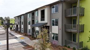 Santa Rosa apartment for rent - Apartment building with a parking lot in front.
