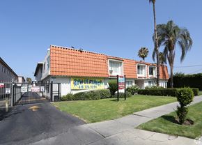 Reseda apartment for rent - A building with a red roof and a sign that says "Row Leasing" is visible.