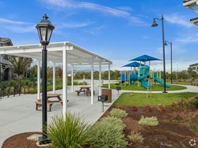 Gilroy apartment for rent - a playground and pavilion in a park with a blue slide