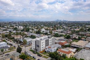 Los Angeles apartment for rent - A cityscape with a mix of residential and commercial buildings under a partly cloudy sky.