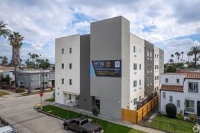 Los Angeles apartment for rent - A modern building with a sign that reads