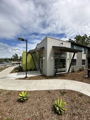 Santa Rosa apartment for rent - A leasing office with a grey exterior and a green accent wall.