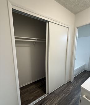 North Hollywood apartment for rent - A white closet with a sliding door is open.