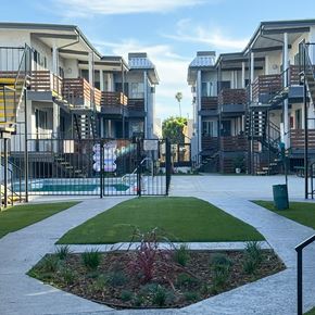 Winnetka apartment for rent - A residential area with apartment buildings and a small garden in the foreground.