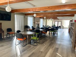 Verdugo City apartment for rent - A room with wooden floors and a large table surrounded by chairs.