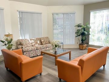 Verdugo City apartment for rent - A living room with a sofa, two chairs and a coffee table.