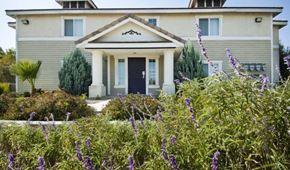Jurupa Valley apartment for rent - A house with a black front door and a small porch.
