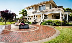 Jurupa Valley apartment for rent - A house with a red brick walkway in front of it.