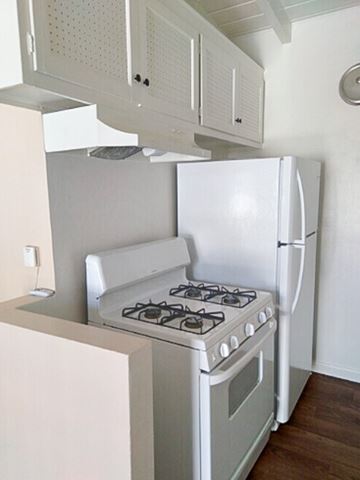 Reseda apartment for rent - A white stove and refrigerator in a kitchen.