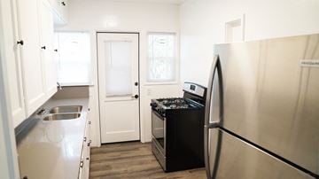 Long Beach apartment for rent - a kitchen with stainless steel appliances and a stove and refrigerator