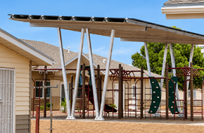 Douglas apartment for rent - A playground with a slide and swings under a canopy.